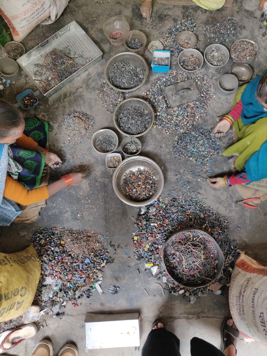 Informal sector workers in India sorting electronic waste