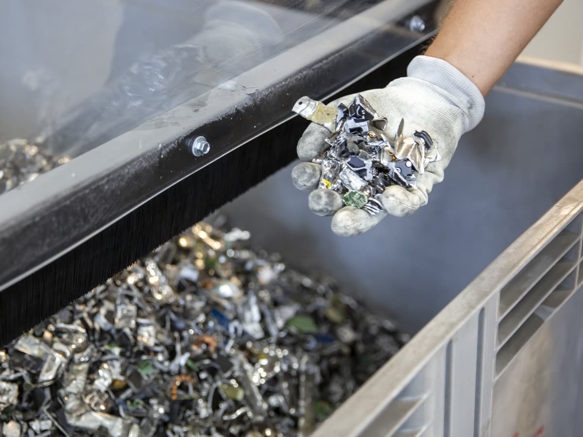 A hand with electronic scraps