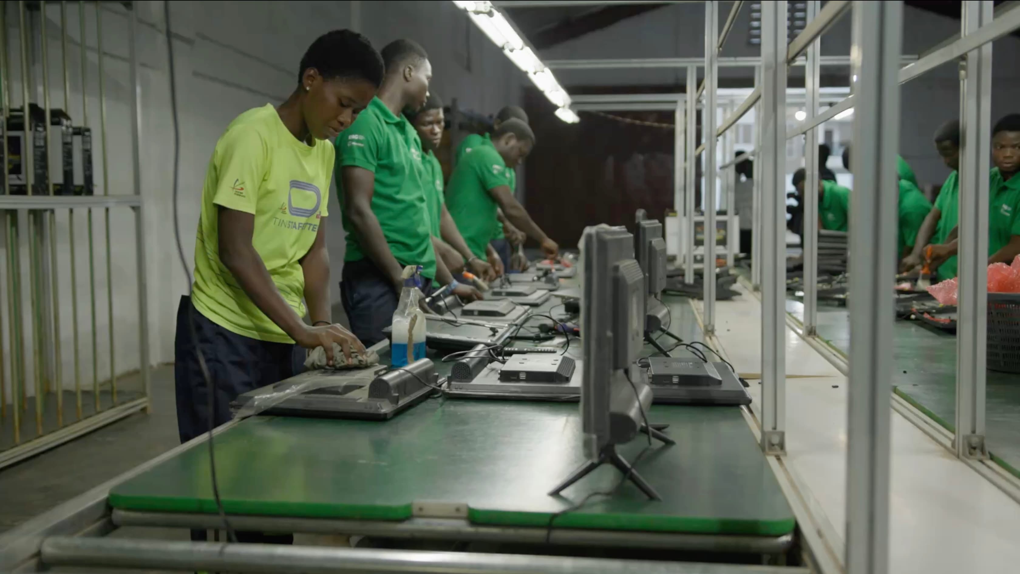 Workers assembling a TV